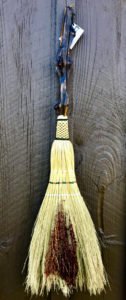Broom created by Mark Hendry - Heart of Pine Driftwood lacquered handle with green stitched plaiting and white & tan with green “X” stitches in waxed linen. Red seeded Broomcorn (sorghum bicolor) accent.